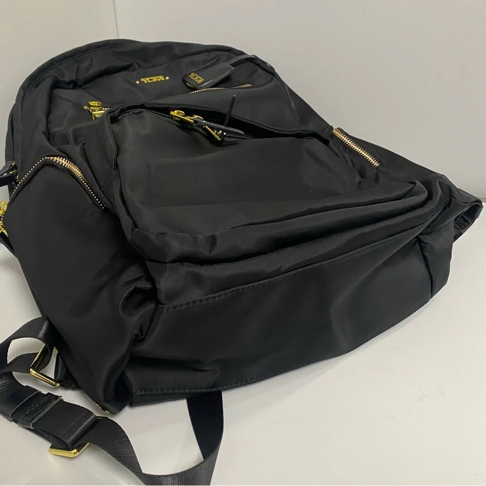 Tumi Black Backpack with Gold Zippers
